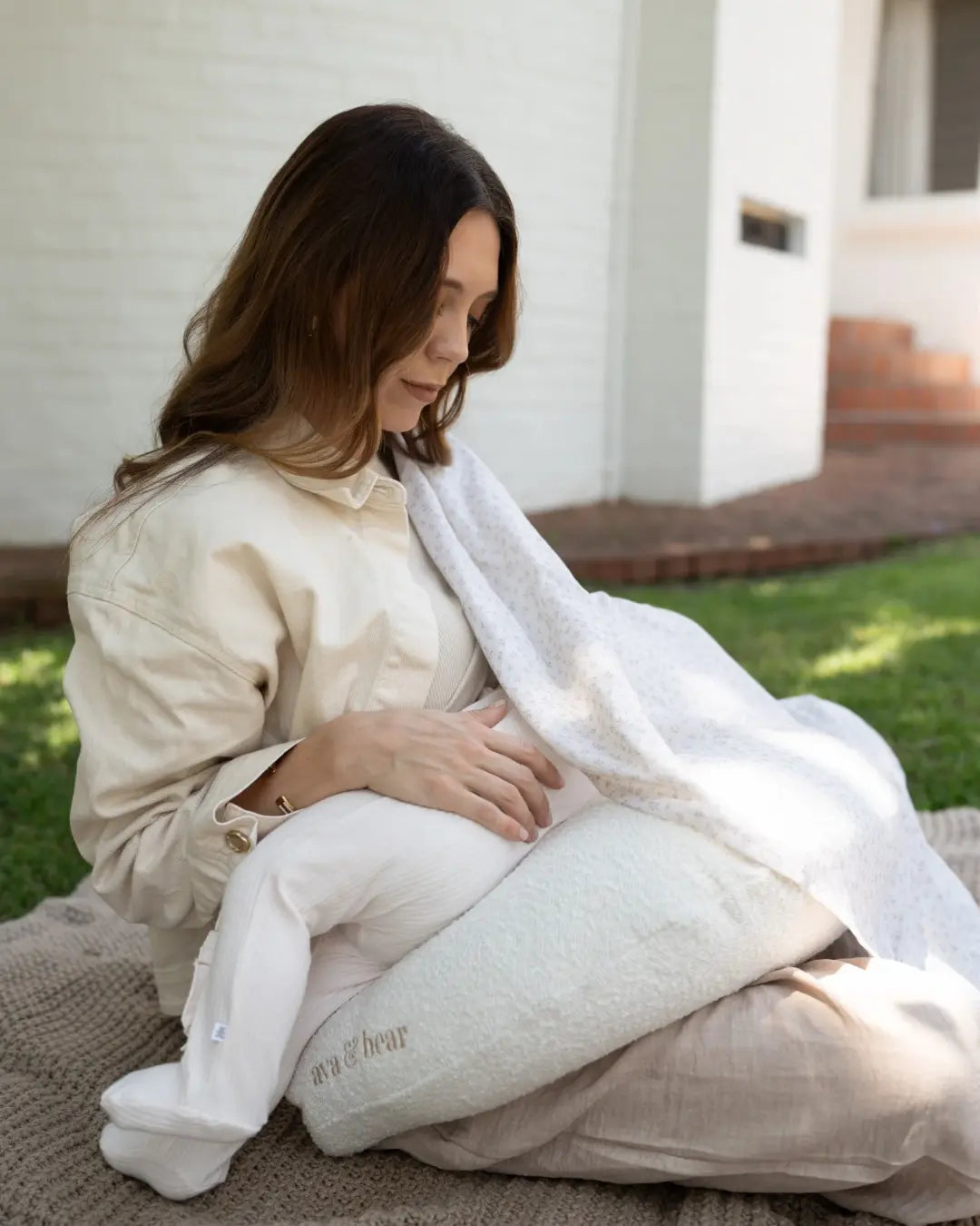 Ava & Bear Boucle Crescent Nursing Cushion in the nursery