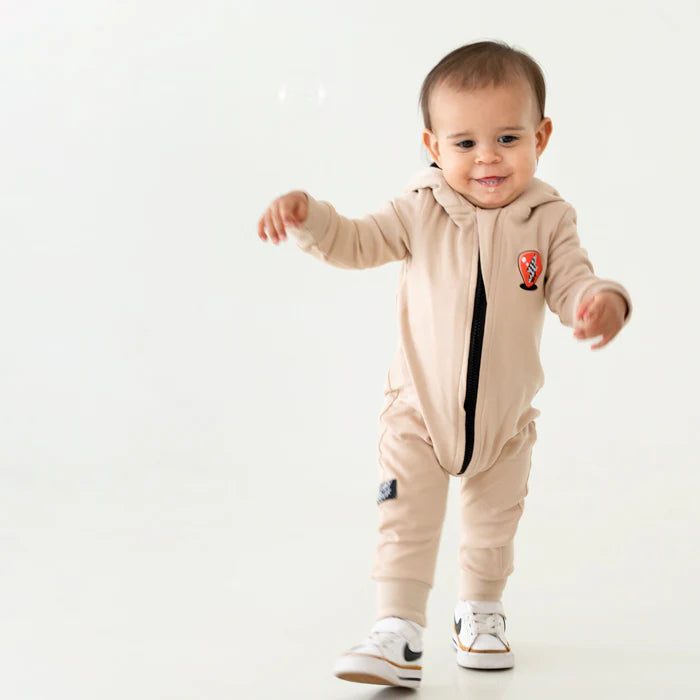Lullaby Rock Rockstar Vibes Zip-Up Onesie in Tan – Hooded Fleece Onesie - Motherhood